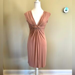 Gently used Max Studio dress in pink with front twist detail. Size XS